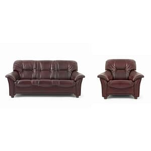 The Roma brown leather sofa and matching armchair, featuring plush cushions and curved armrests, are displayed side by side against a white background.