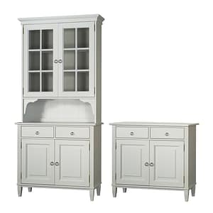 Two matching white Stockholm skänkvitrin cabinets: one is a tall hutch with glass upper doors, open shelf, drawers, and lower doors; the other is a shorter cabinet with two drawers and two doors.