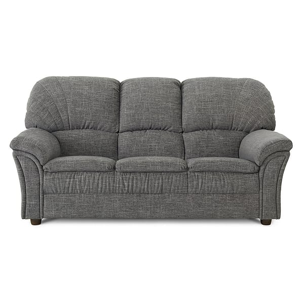 The Grand is a gray three-seater fabric sofa featuring plush cushioned backrests and armrests, subtle stitching, and short dark wooden legs.